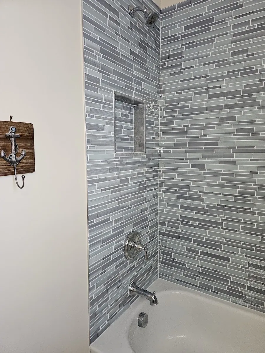 Tiled tub and shower surround with new fixtures